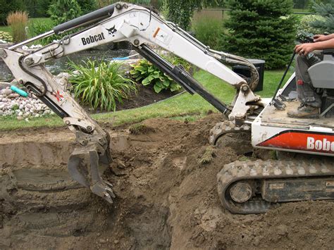 How to Dig a Pond With an Excavator 